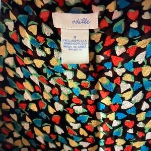 Anthropologie sleeveless swing top with black ribbon tie under bust